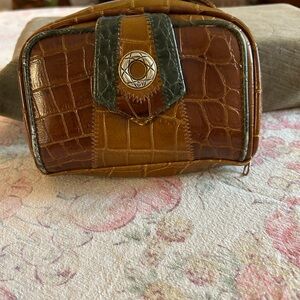 Small throw over the shoulder leather purse.